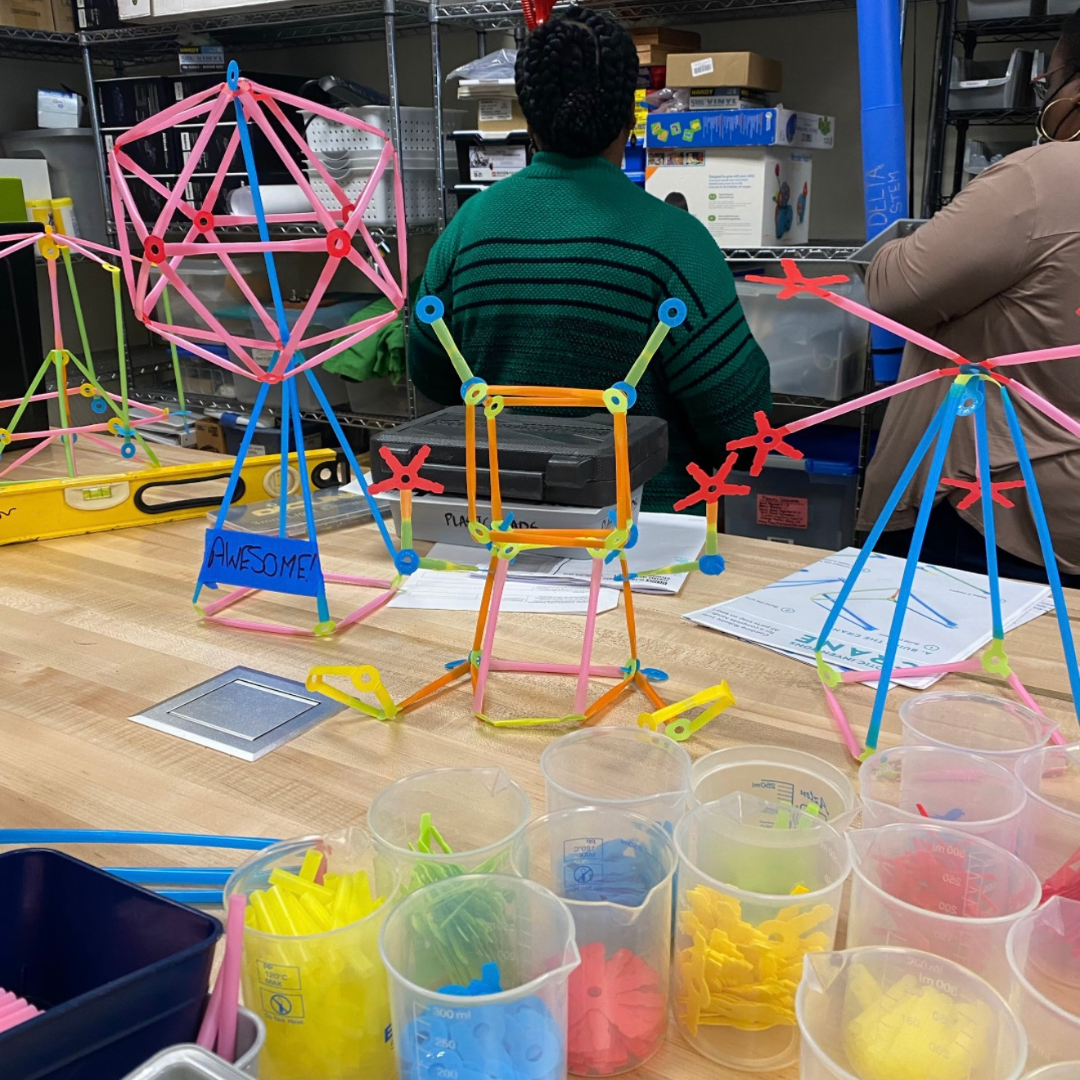 A table with a series of Strawbees builds.